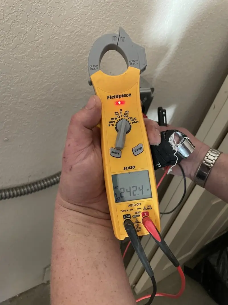 Voltage testing with clamp meter during Ceiling Fan Installation in Urbana